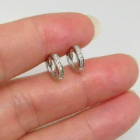 /public/photos/live/Round Cut Moissanite Tiny Huggies Hoop Earrings 828 (1).webp